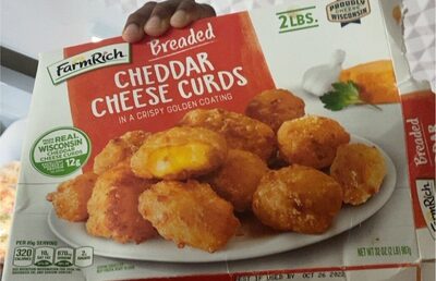 Breaded cheddar cheese curds in a crispy golden coating - Producto - en
