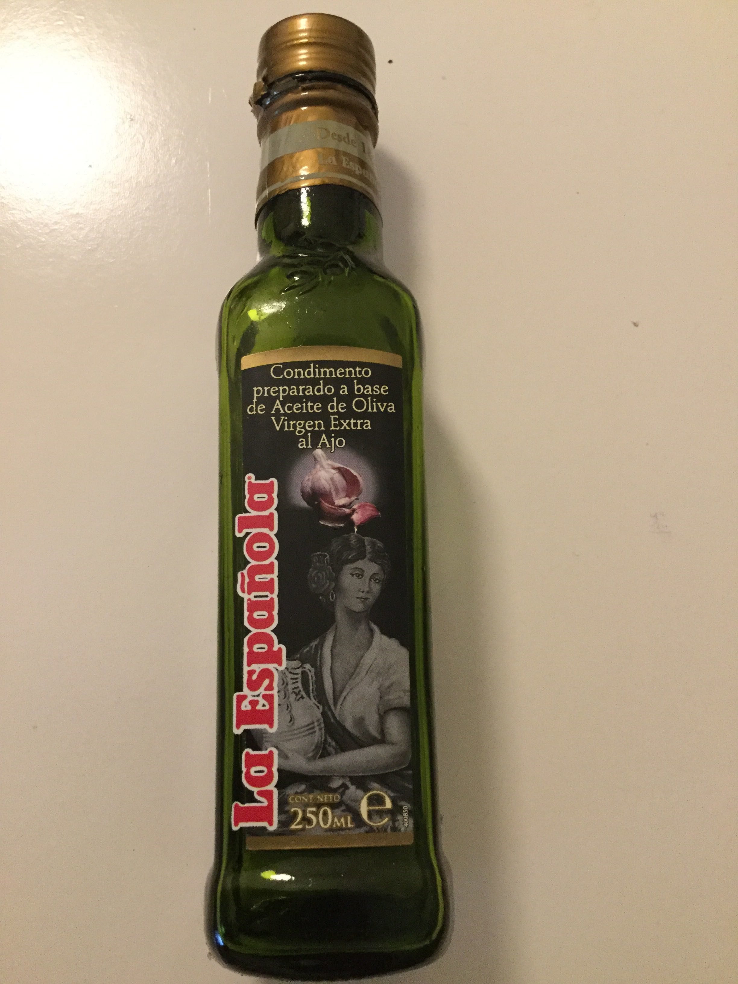 Aceite de oliva virgen extra al ajo botella 250 ml - Producte - es