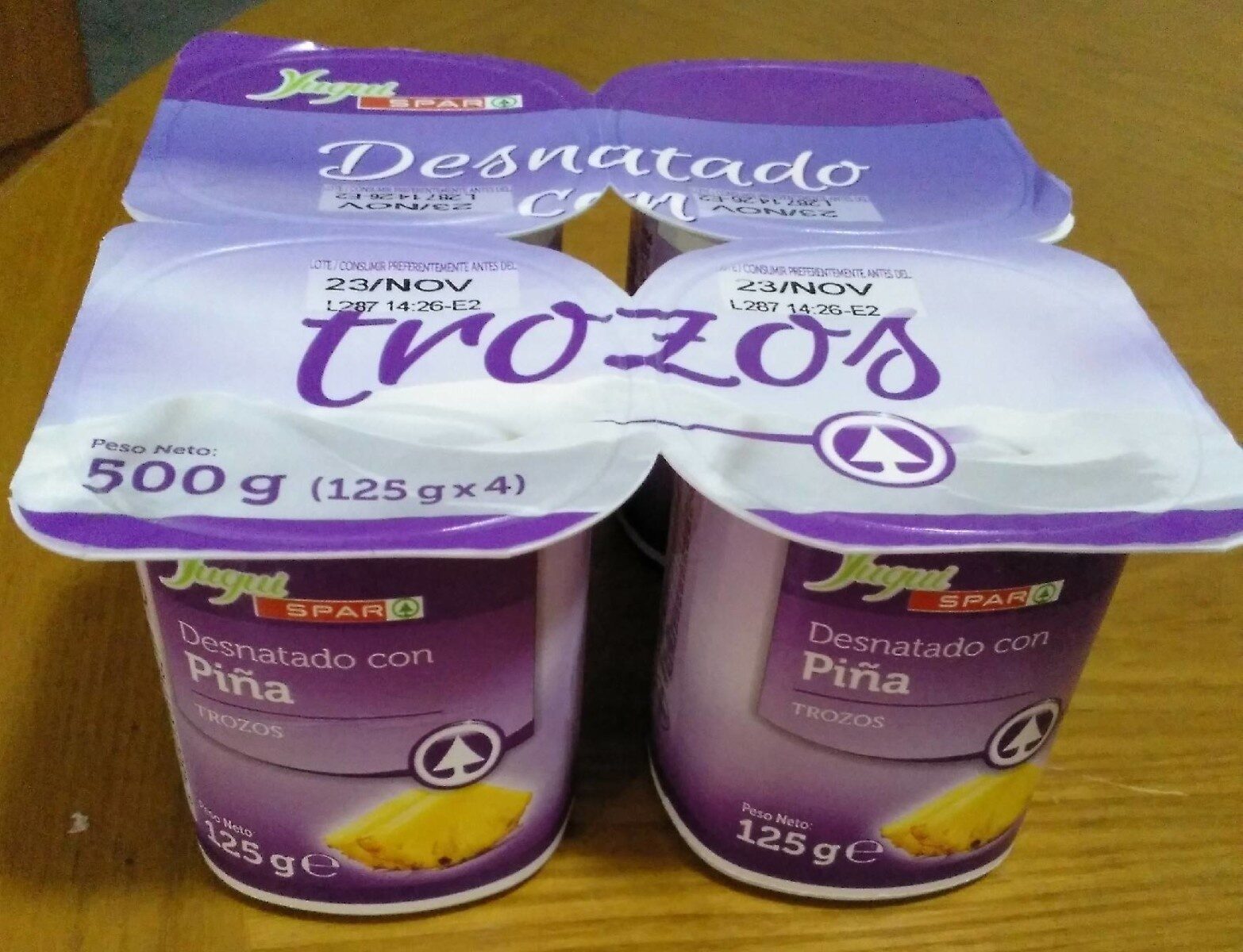 Yogur desnatado con piña (trozos) - Producte - es
